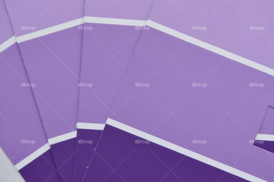 Lavender, graduated shades of pale, pastel purple paint strips.