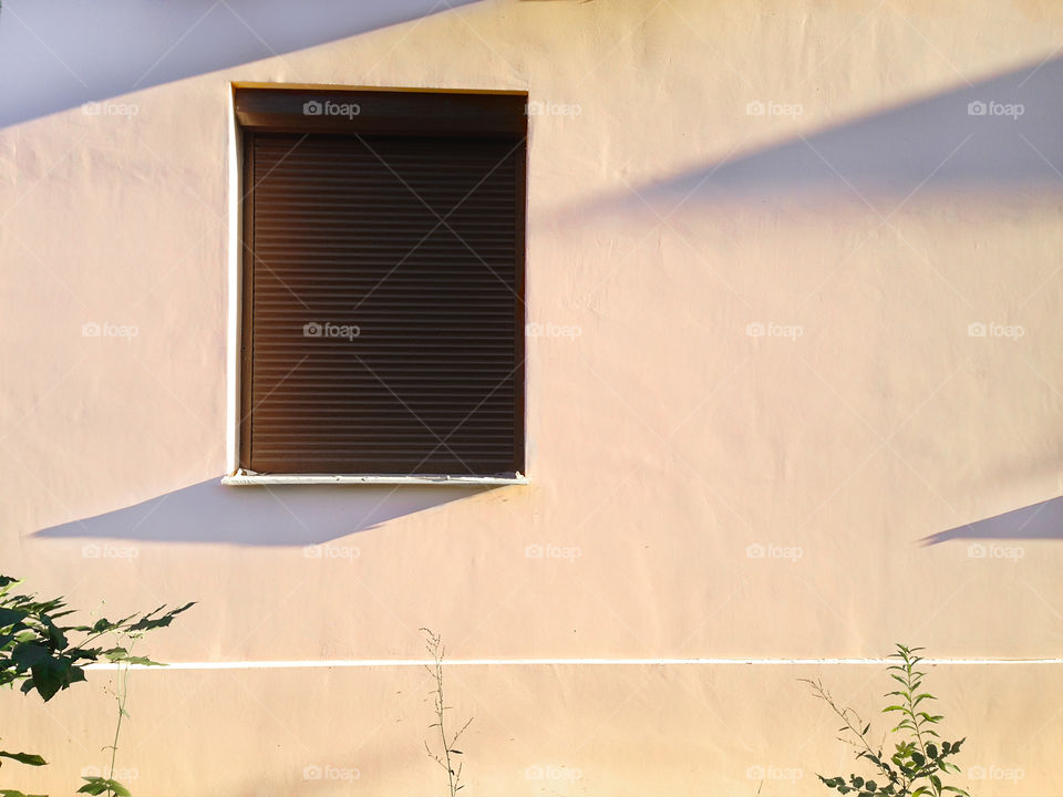 Window with lights and shadows on pastel wall background 