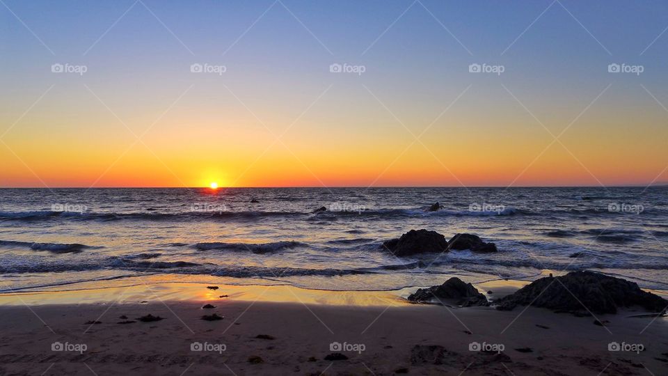 View of beach during sunset