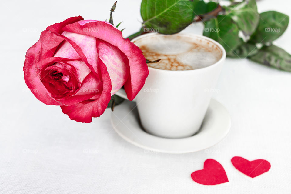 cup of coffee and a rose