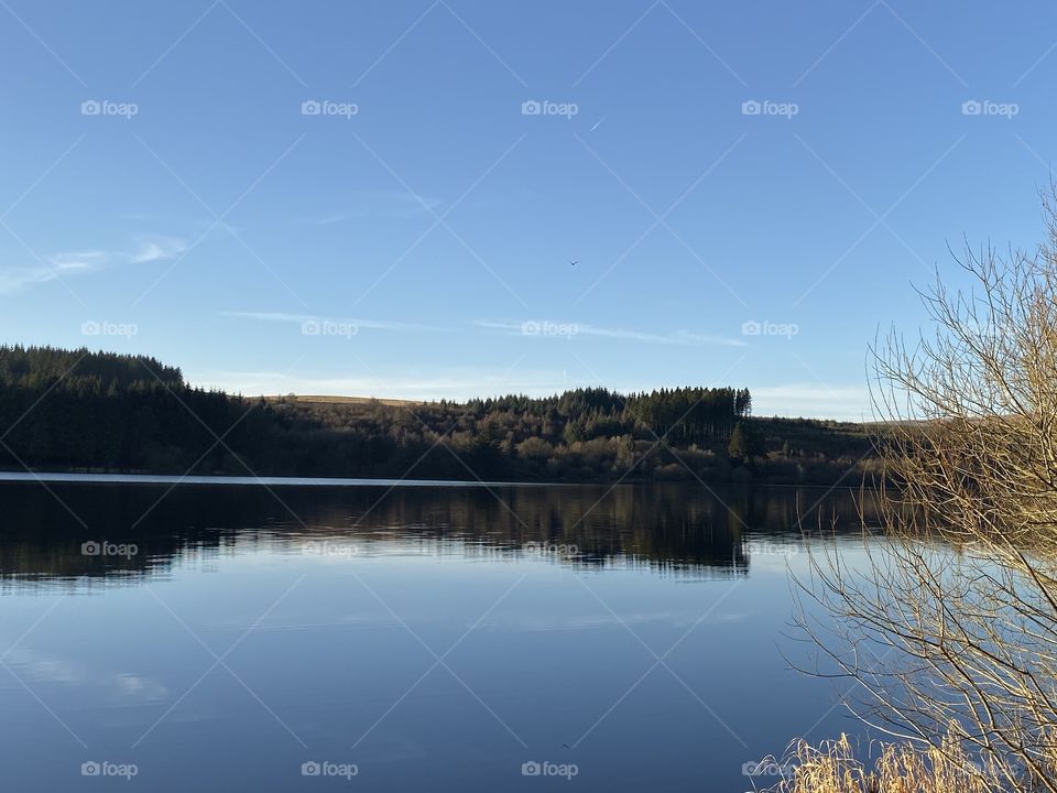 Rippled freezing water and bight blue sky.