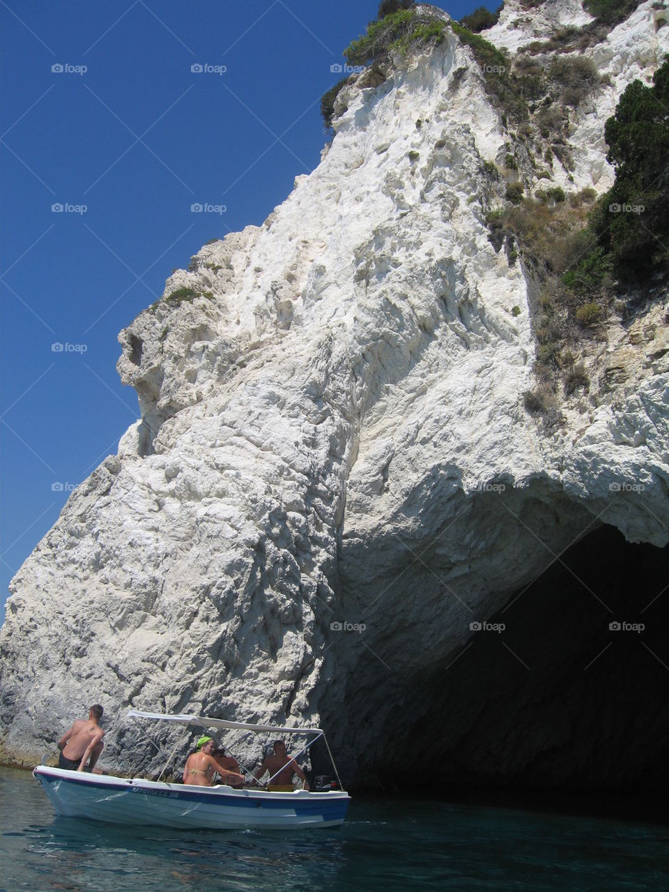 boat on the exit of the cave