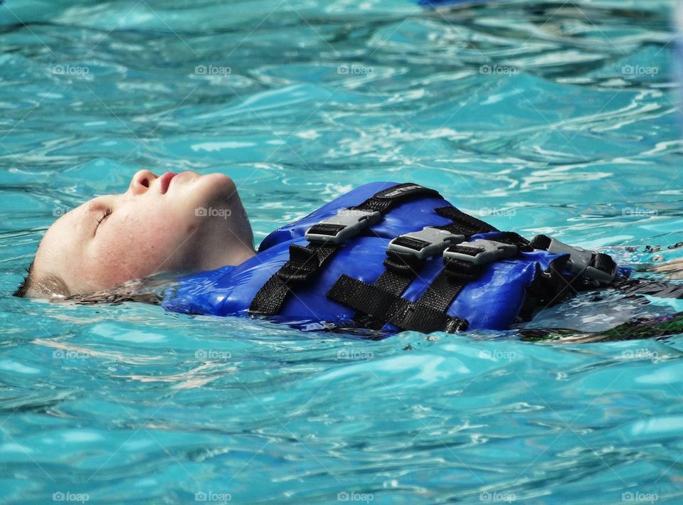 Boy Learning To Swim