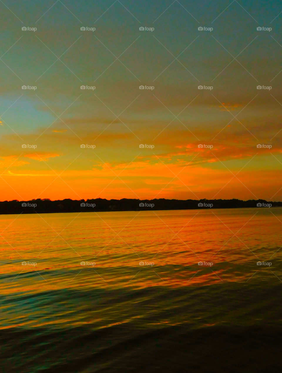 Golden Yellow Blushing Sunset!
The sunset glimmers across the bayou waterway as the sun descends below the horizon!