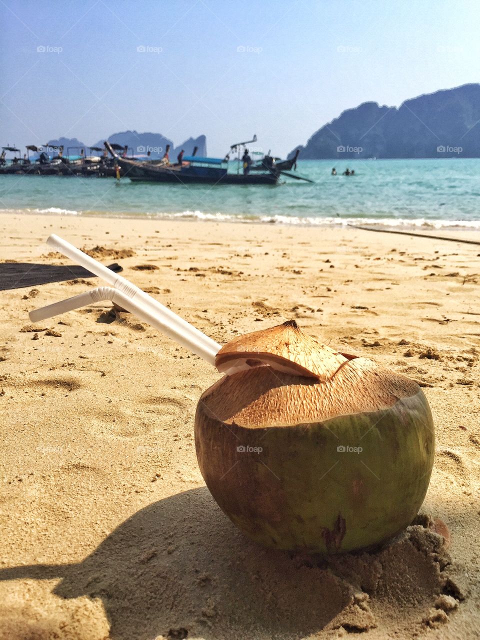 Coconut on sandy beach