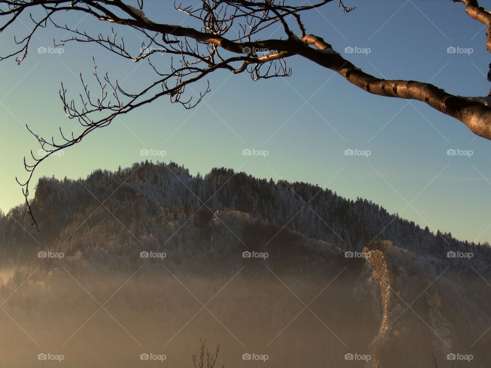 Sunrise and foggy mountains view