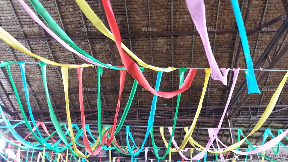 Colorful fabrics tie on the beams