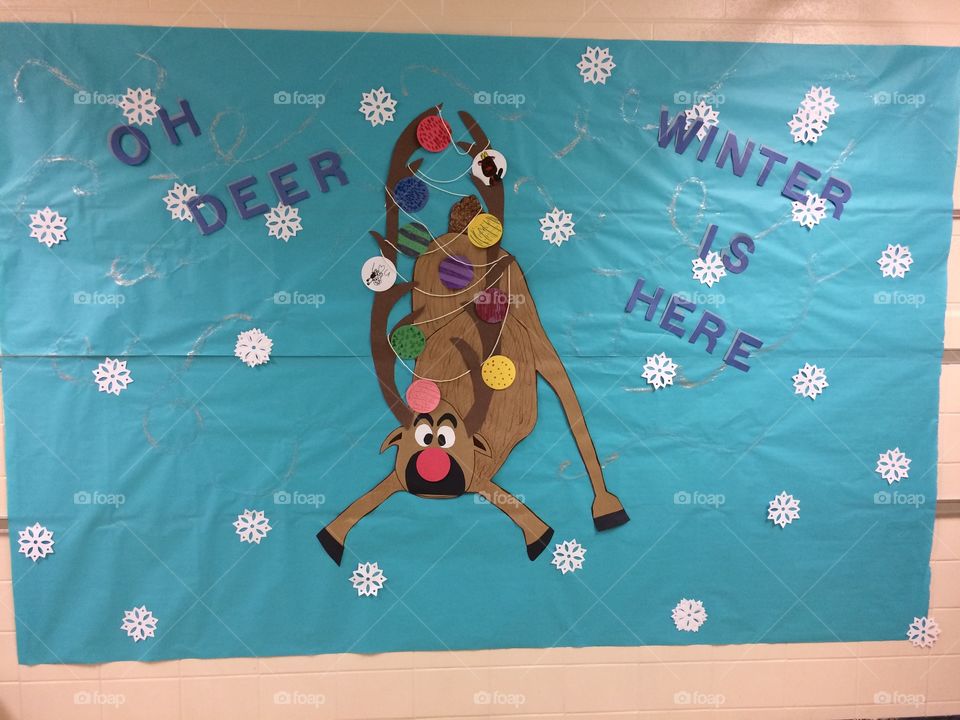 school bulletin board with deer winter snowflakes