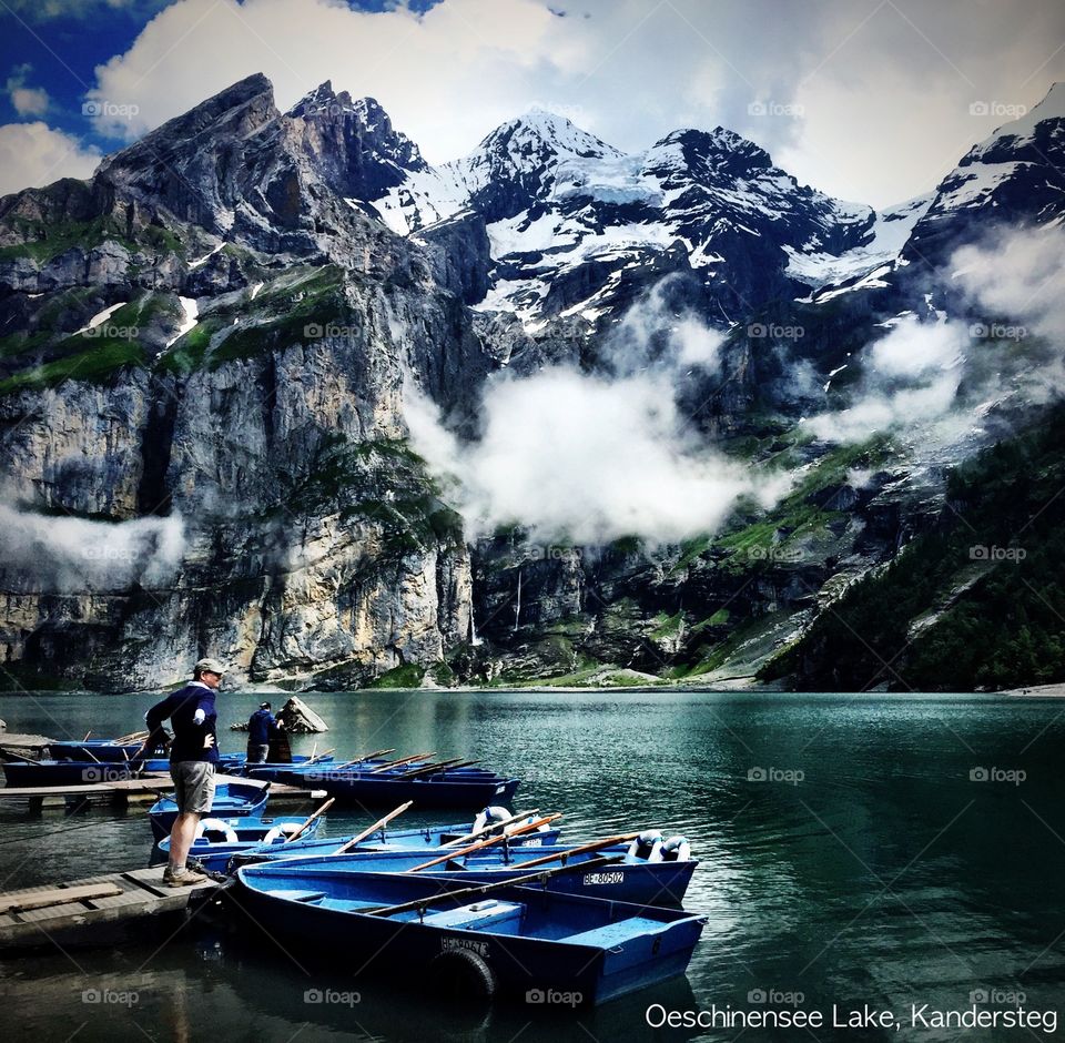Rowing boats line the dock of Oestchinensee Lake, Switzerland
