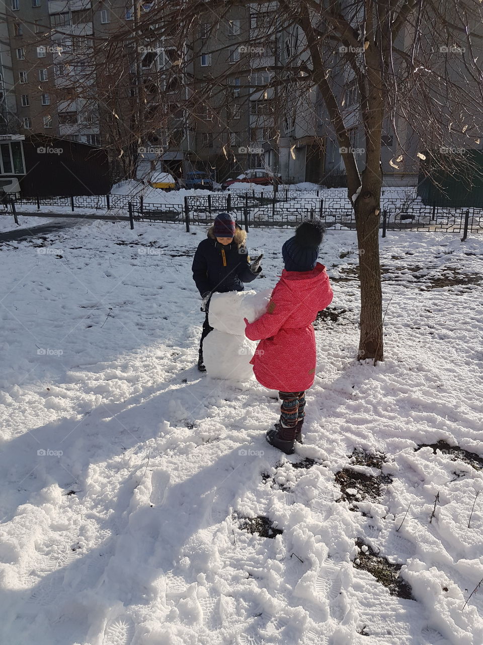 children play with snow