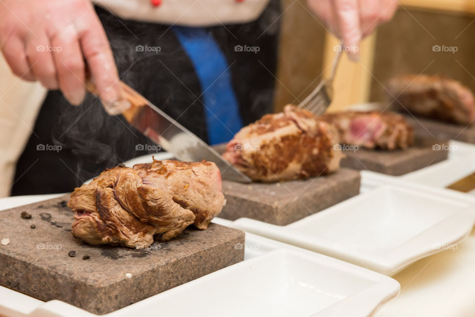 Steak cooked on rock