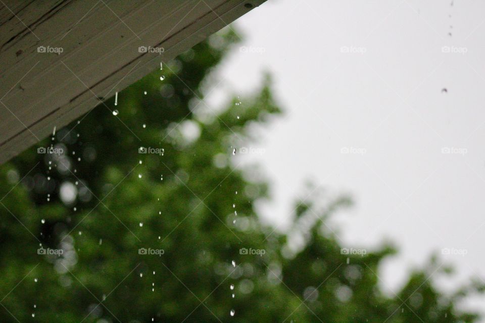 Minimalistic Snaps - raindrops off a roof overhang