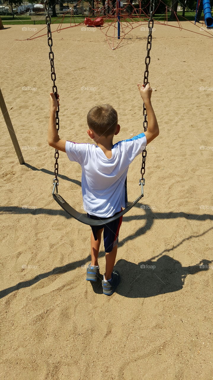 Boy On Swing
