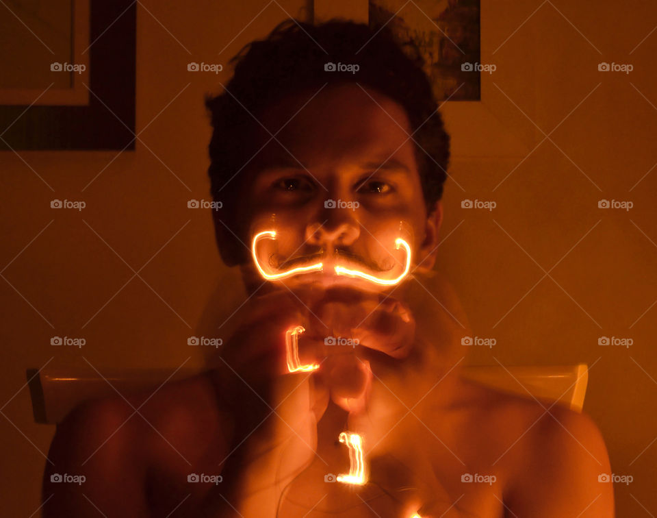 man doing light painting