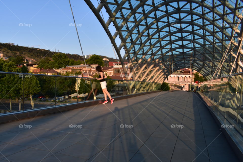 Enjoying view from modern bridge in old town Tbilisi