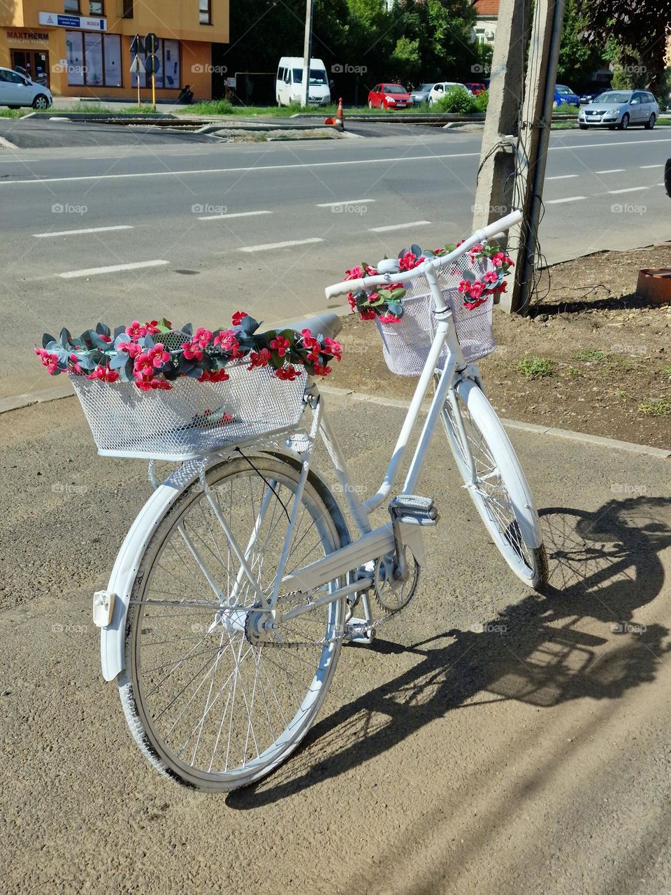 white bicycle with flowers