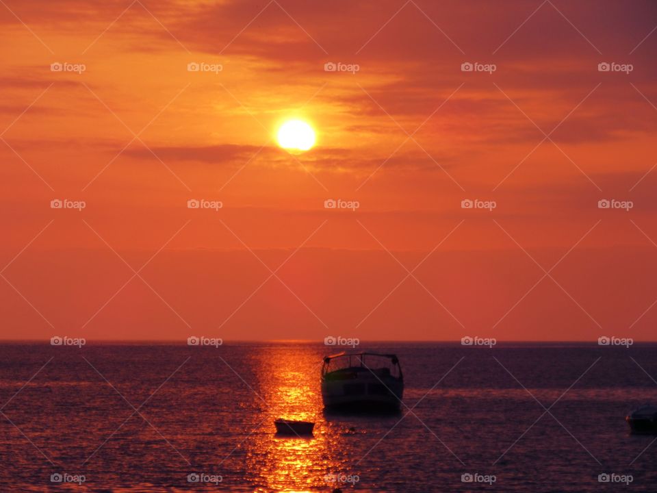 Sun over the sea of Praia ( Italy ) at Sunset.