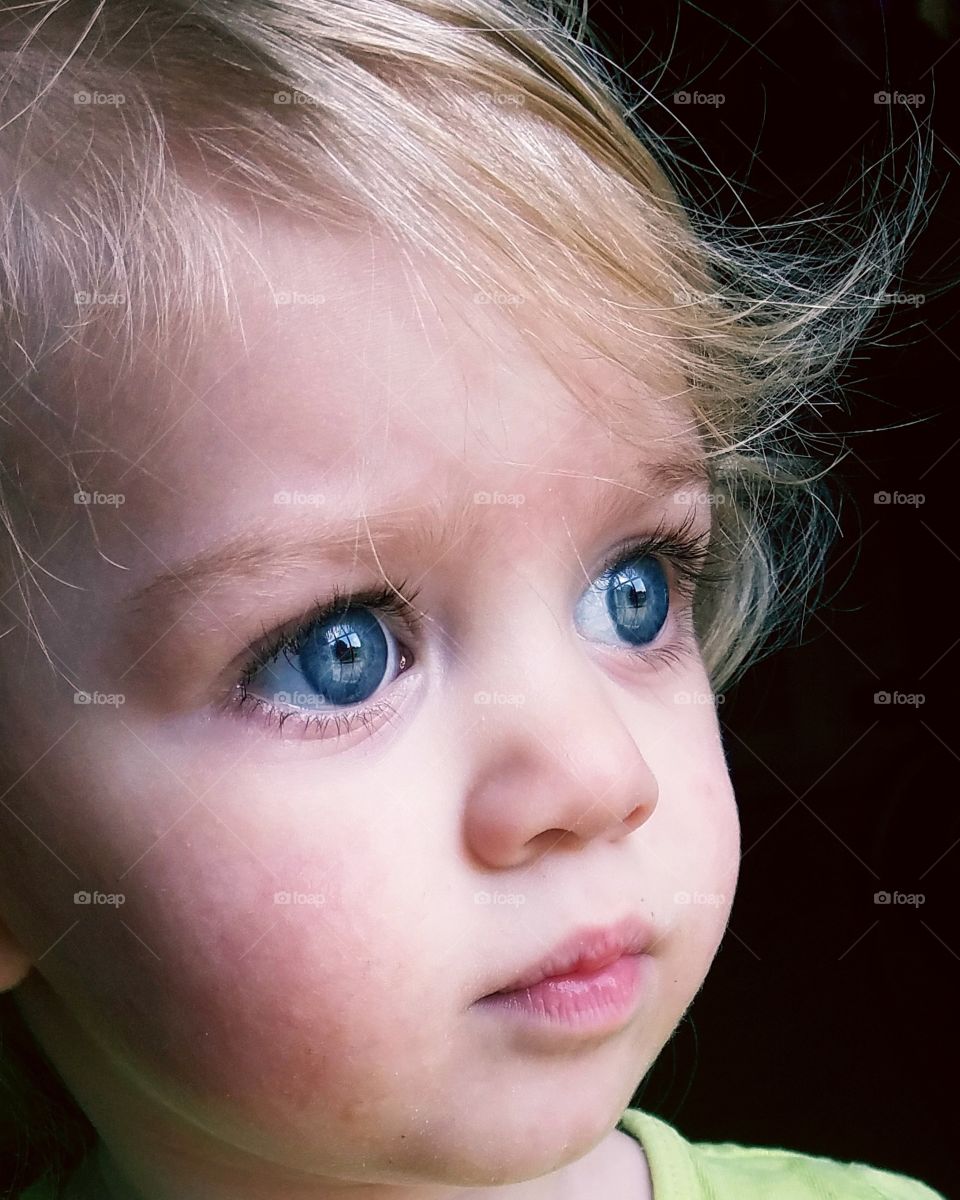 blue eyed toddler full of wonder