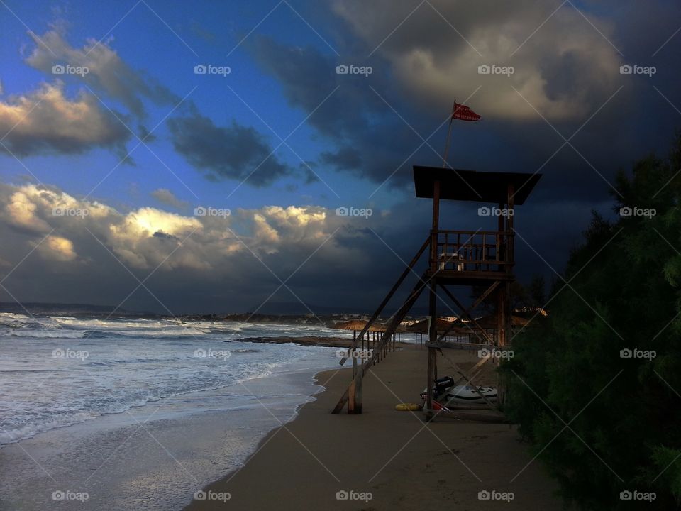 Storm clouds over idyllic sea at dusk