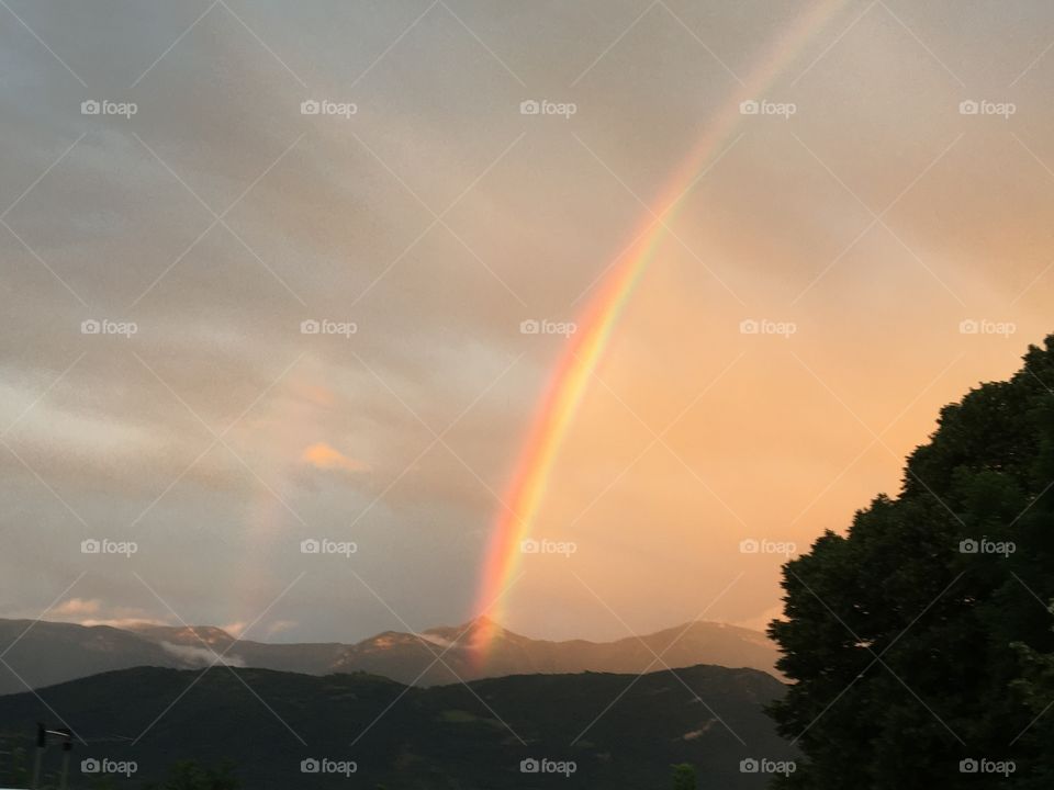 Orange evening light with rainbow 