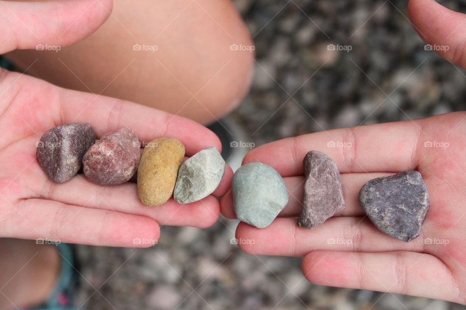 Hand of a person holding cobblestones