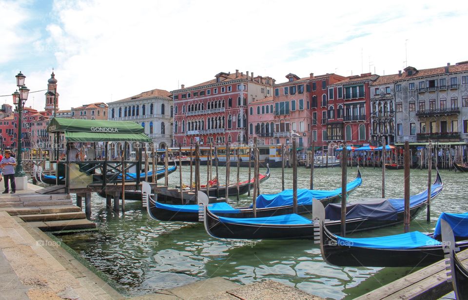 Gondolas on the grand canal. Gondolas lined up on the grand canal in Venice.