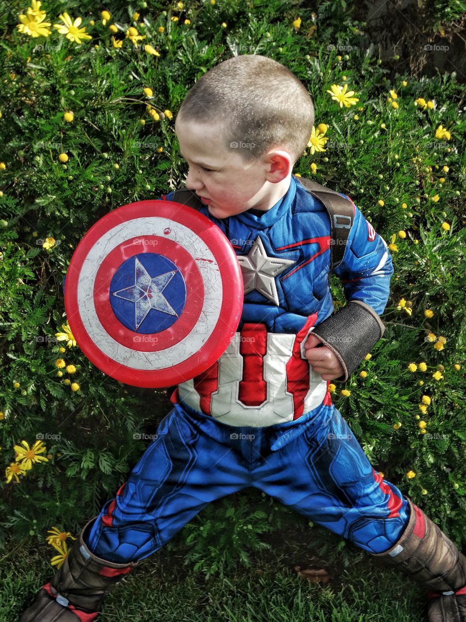 Boy wearing captain america costume