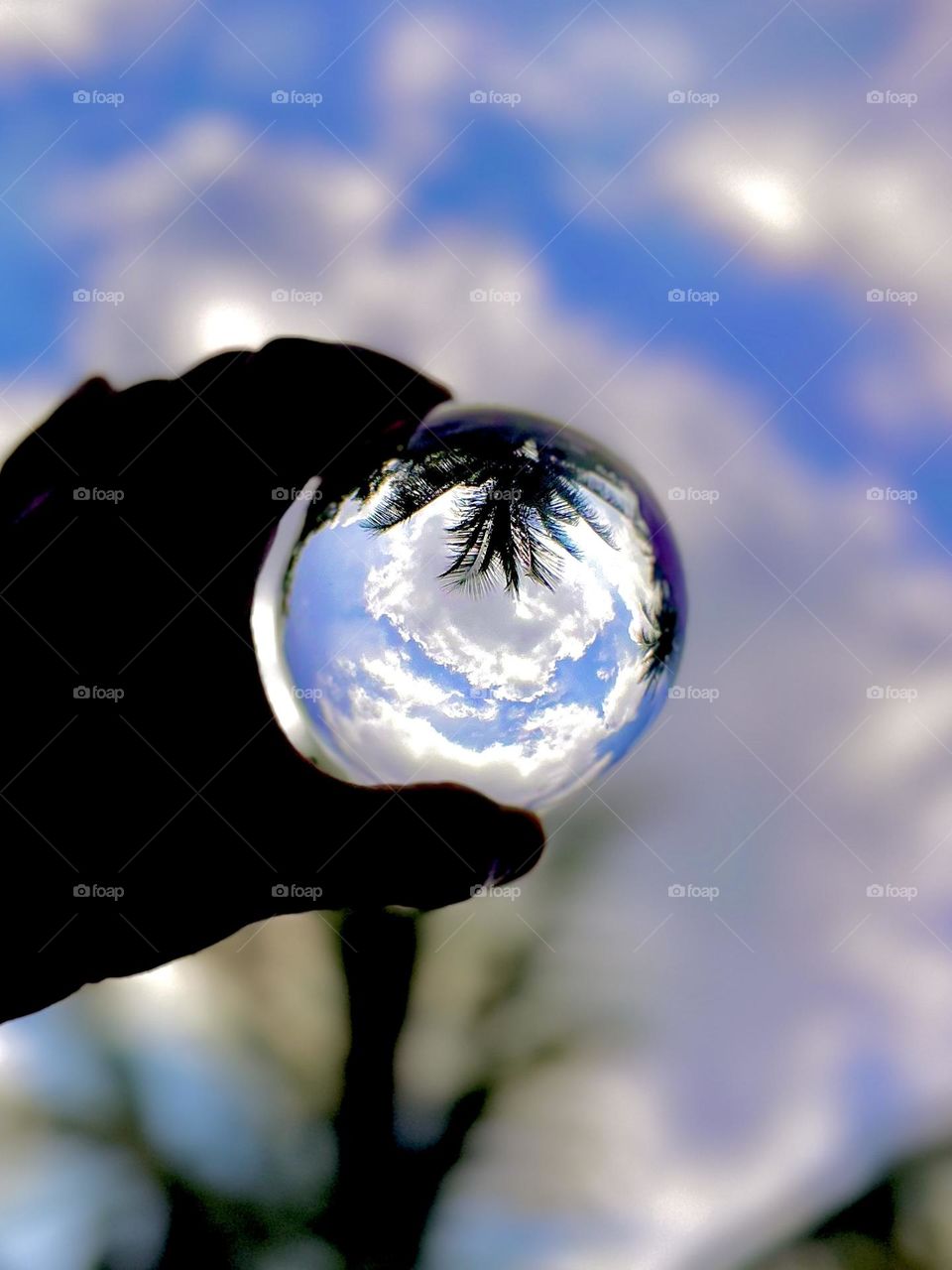 Lens ball photography - Clouds within glass ball 