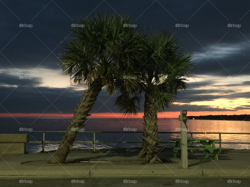 Sunset on the bay with dramatic sky