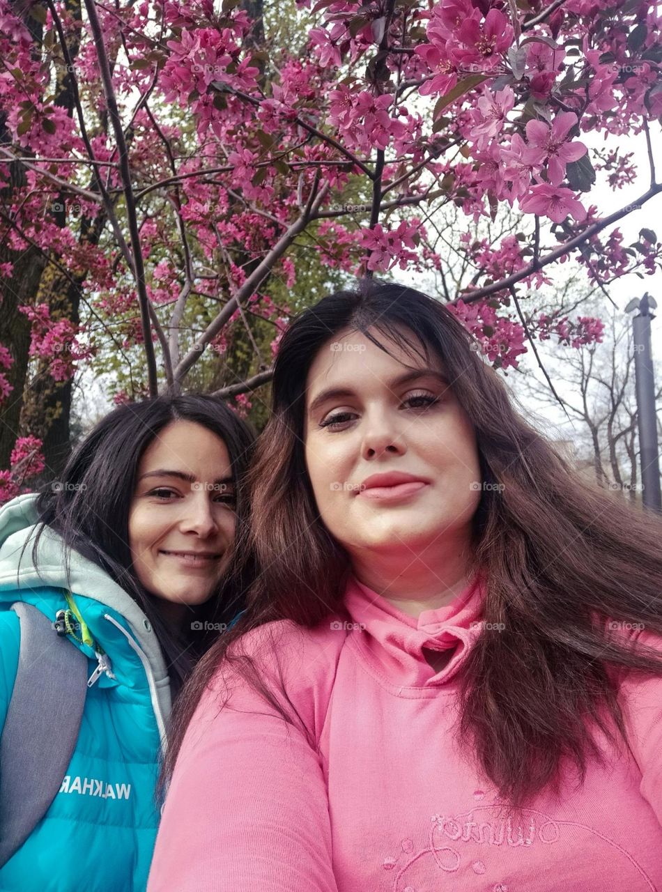 Me and my friend under the spring blooming