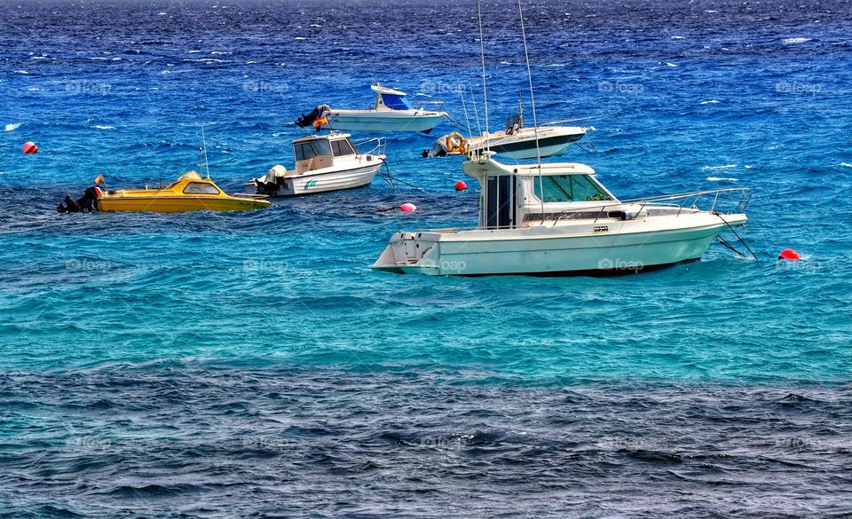 colorful fishing boats in punta de mujeres on lanzarote canary island in spain