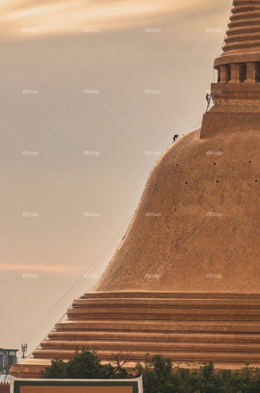 Climber to the top of big pagoda in Thailand