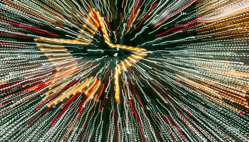 Zoom burst of Christmas tree lights