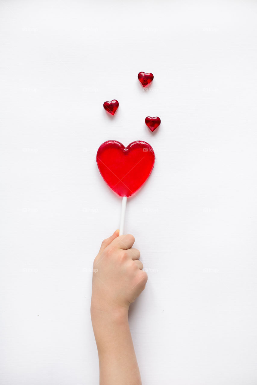 Studio shot of human hand with sweet food