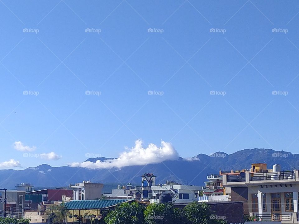 Blue hills and even deeper blue sky adding to the beauty of the town