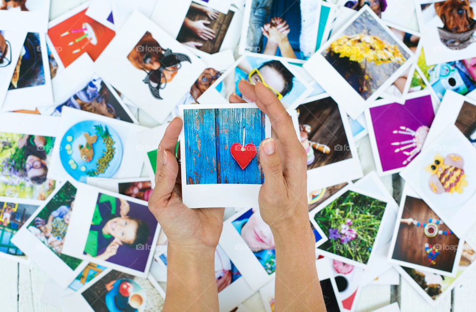 Set of polaroid photos in hands for good memory