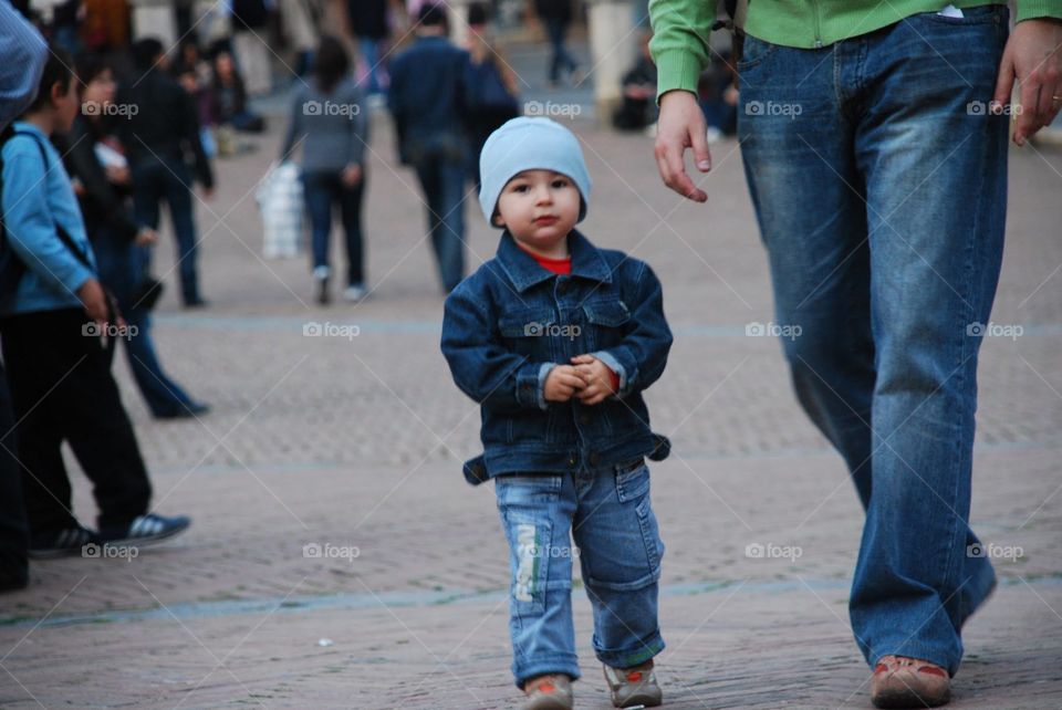 Little boy in a blue hat. A childhood moment of a little boy 