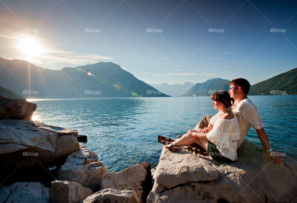 Couple on the bay at sunrise