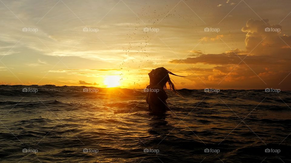 Enjoying the ocean while sunset