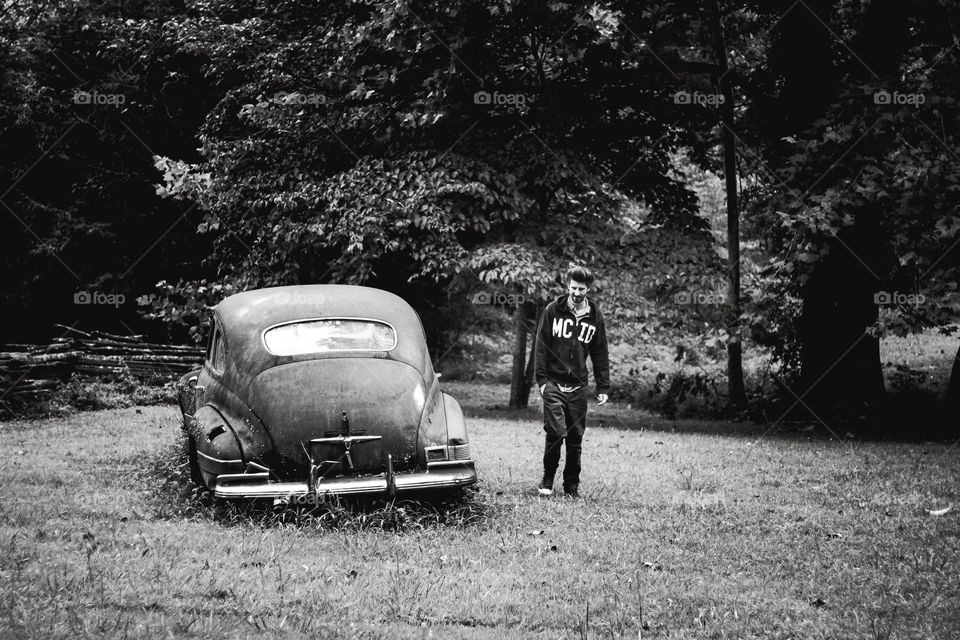 young man and old vintage car