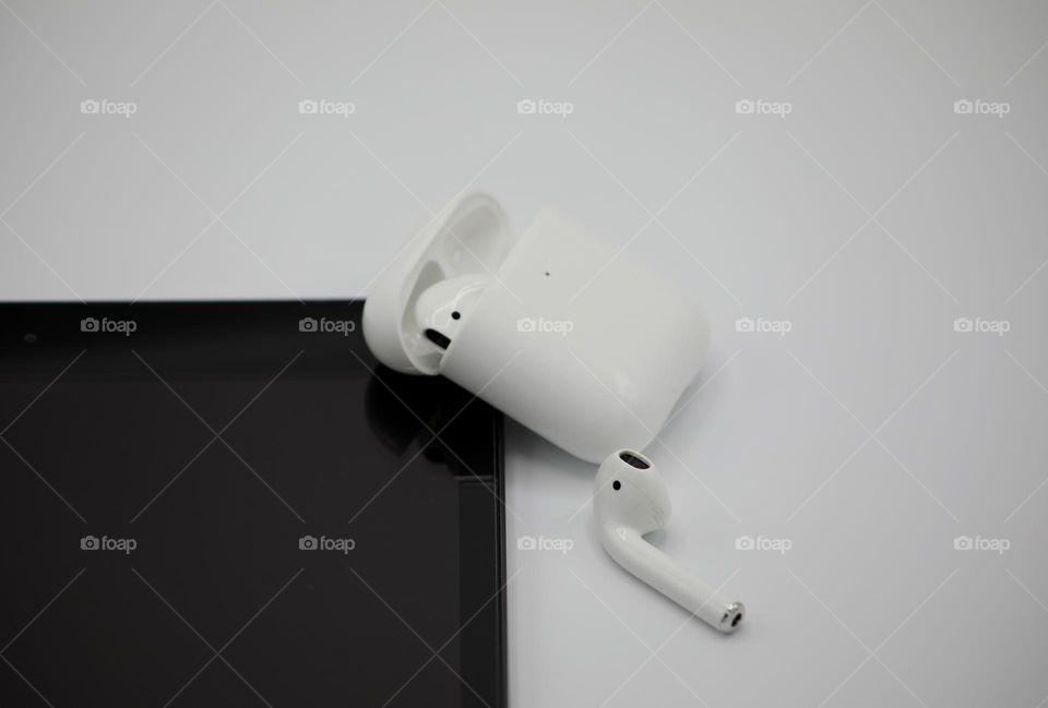 Apple; clean, white setting; ipad and airpods