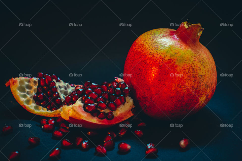 pomegranate fruit on dark background