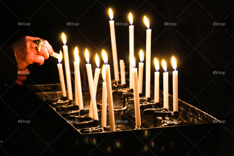 lighting candles at St. Mark's Basilica