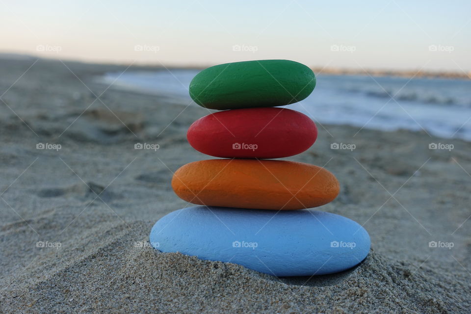 Stack of colored stones on the beach