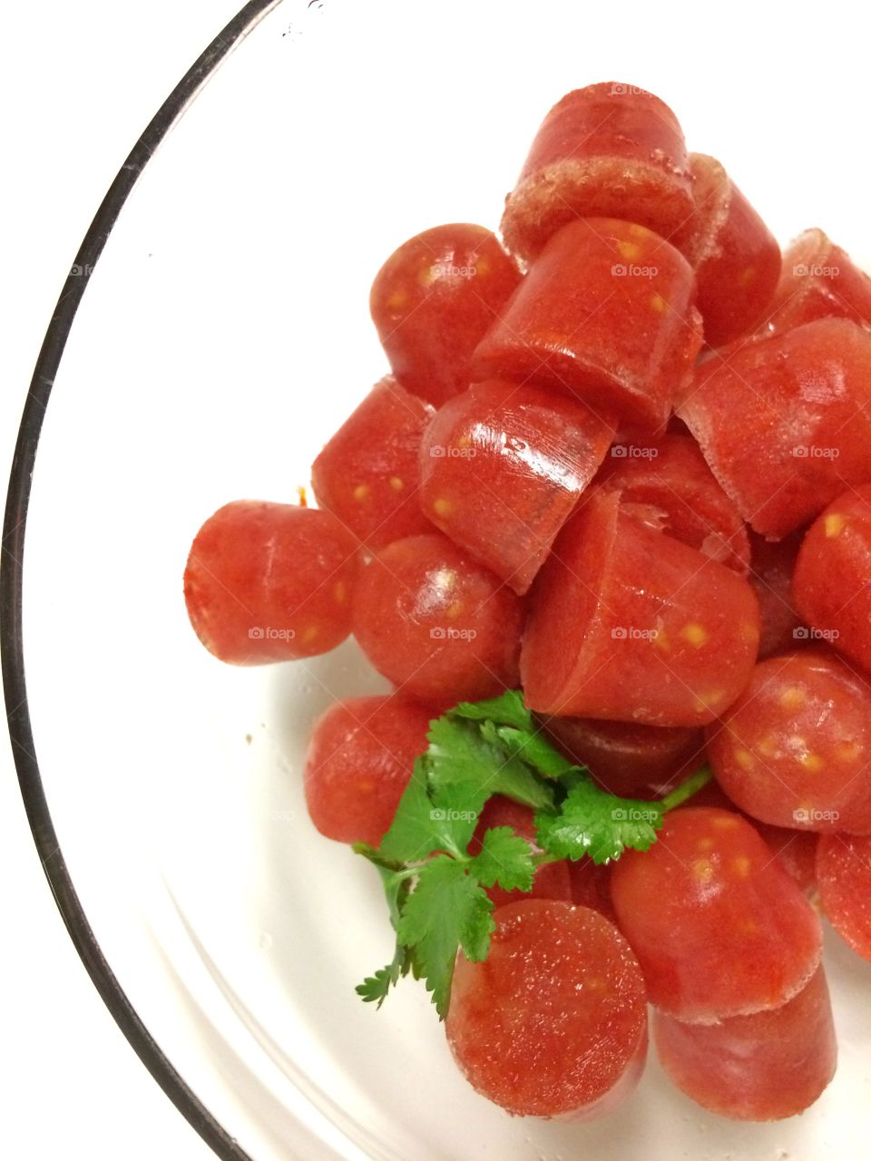 Frozen puréed tomatoes in glass bowl