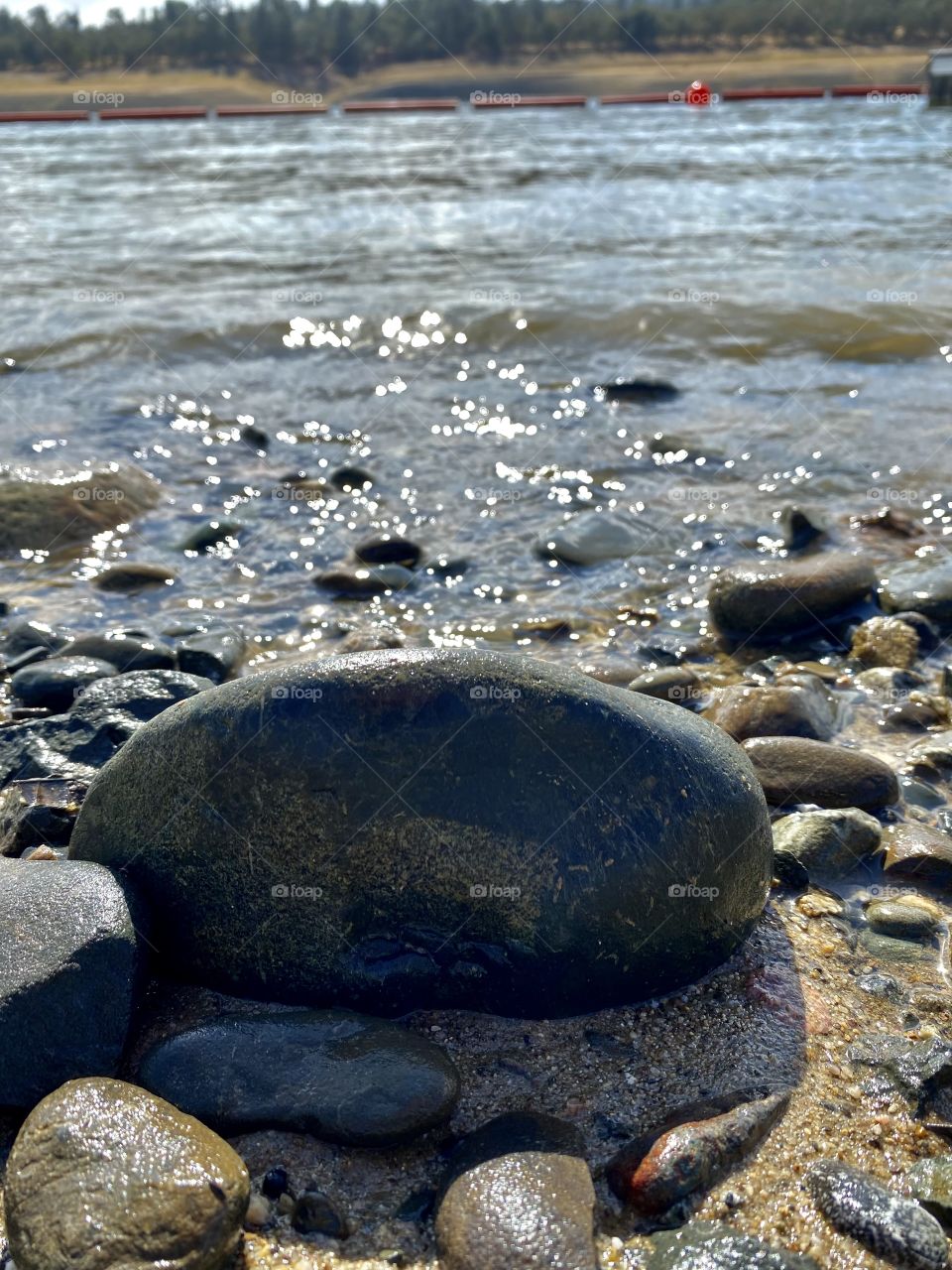 Rocks on a beach in Lake Nacimiento California 