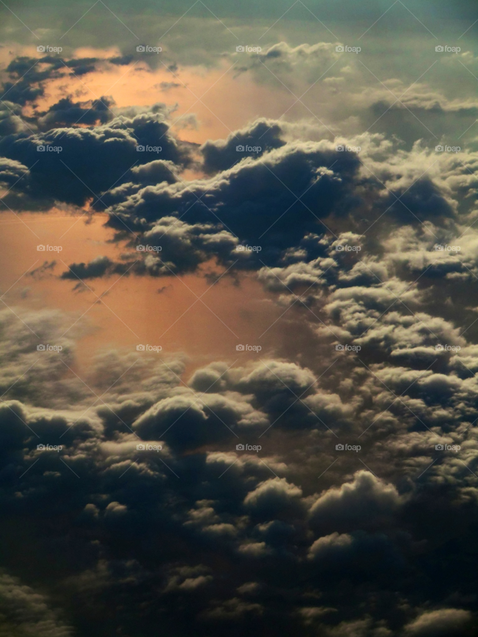 Over the clouds. Up on a flight above the pink clouds