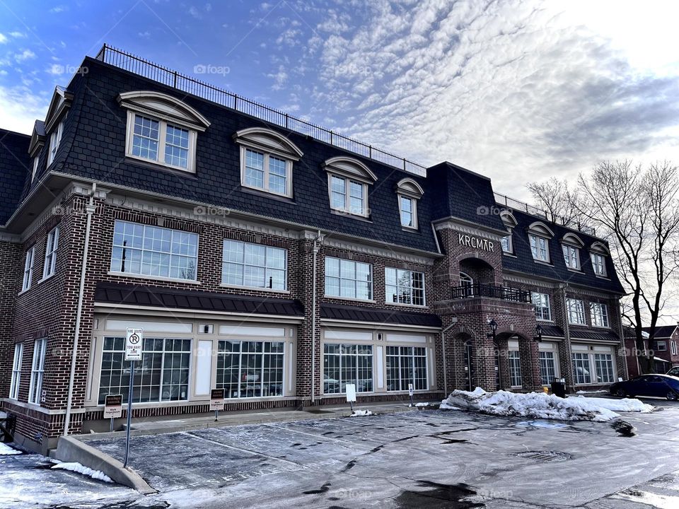 Pretty building , blue clouded sky 