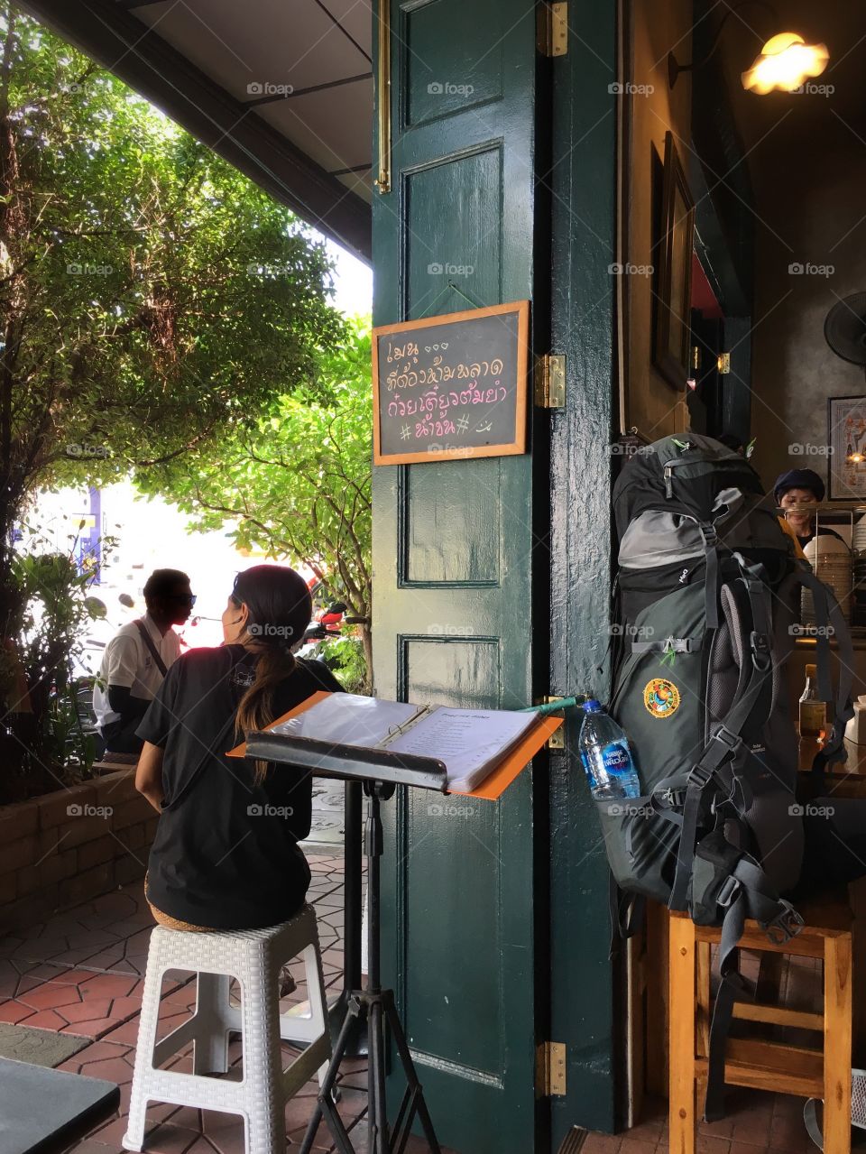 Traveler rests for a while on the white chair 