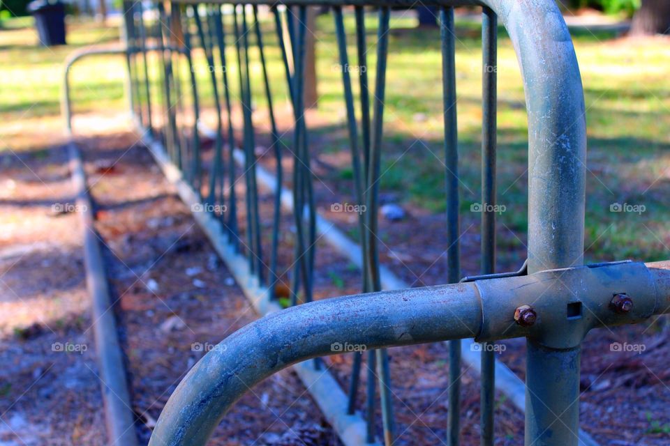 Park with empty bicycle rack on a Saturday morning